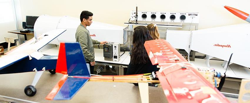 Students working in lab with plans