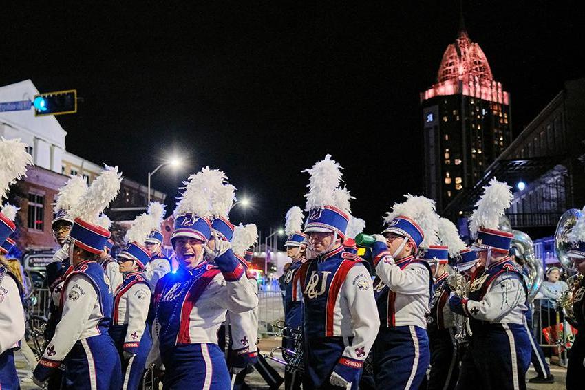 Jaguar Marching Band waving and smiling