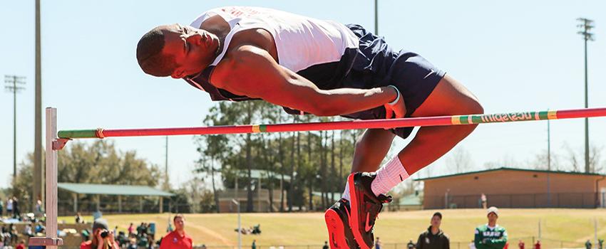 Track student pole vaulting