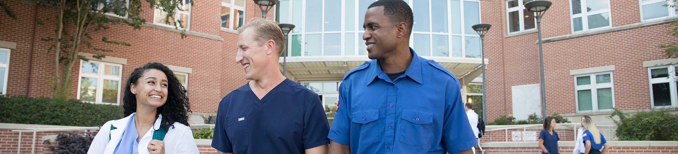 Allied Health students walking outside of the Allied Health building.