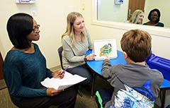 Staff working with patient