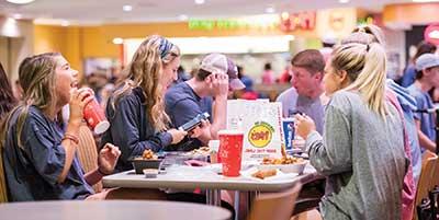 Student getting food in Dining Services.