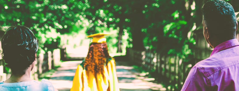 Graduate walking away from parents