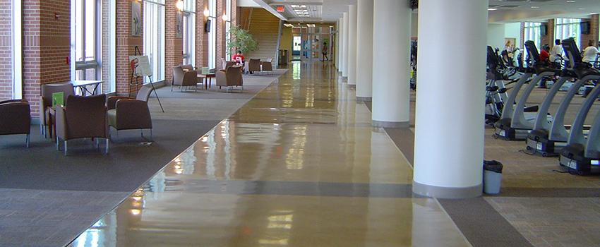 Inside of Campus Recreation walkway in front of machines.