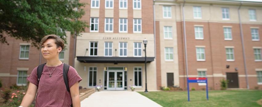 Lexe walking away from Camellia Hall