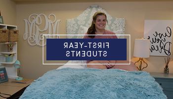 Female student sitting in her bed in her dorm