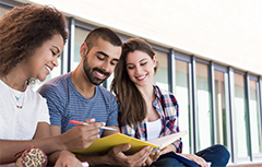 Three students talking sitting