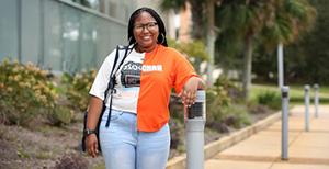 Female student standing outside.