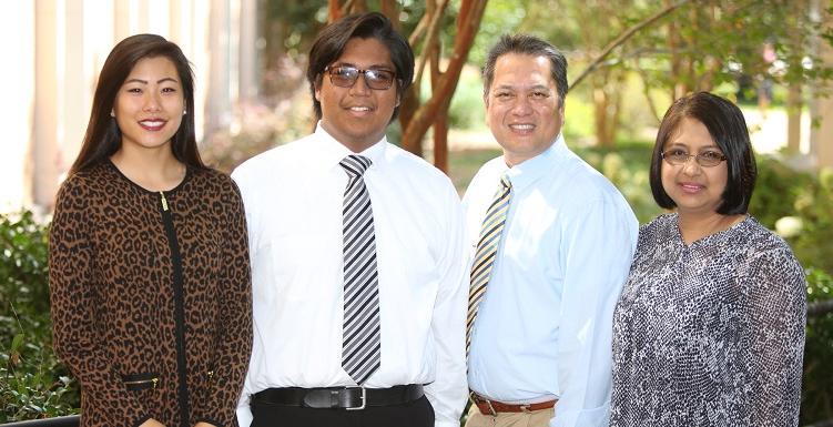 Christian Manganti, second from right, who scored a perfect 36 on his ACT college assessment test, is the 2016-17 USA Board of Trustees Scholar. Manganti's parents, far left, and Shirley Zhang, last year's winner, attended Friday's Board of Trustees meeting.