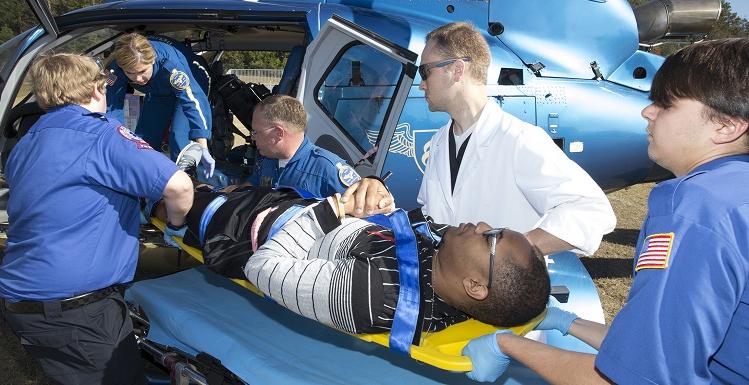 South students in the emergency medical services program load a "victim" onto a helicopter for treatment at a local hospital during an annual disaster drill held Thursday on campus.
