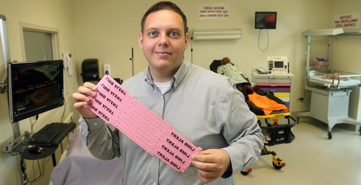 Tyler Sturdivant, alumnus and instructor in the College of Nursing, is giving back by helping to improve health care for patients. He helped start a color-coded wristband initiative at USA Health University Hospital.