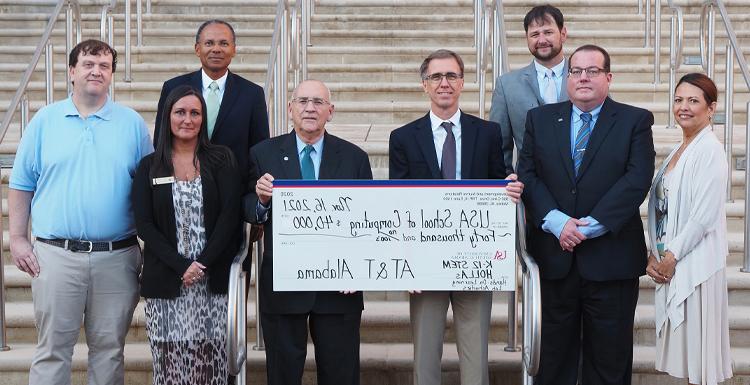 AT&T Alabama contributed $40,000 to support K-12 STEM Hands-On Learning Lab Activities at USA. From left, front row - Lizbeth Stanton, fiber executive, gulf coast region, AT&T; Chris Pennington, southeast regional sales manager, AT&T; Dr. Harold Pardue, interim dean, School of Computing; C. Wayne Hutchens, state president AT&T Alabama; Nikki Donald, CFITS outreach coordinator, School of Computing; Keith Lynn, systems administrator, School of Computing; back row - Matt Coker, client solutions executive II, state of Alabama, AT&T; Glyn Agnew, regional director AT&T Alabama legislative & external affairs.
Photo credit: Mike Kittrell