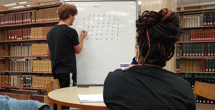 A tutor works with another USA student on the 2nd floor of the Marx Library. A five-year, $2.25 million grant will help Student Academic Success institute a new program dedicated to the "Second Year Experience." The goal is increasing retention rates between year two and year three.