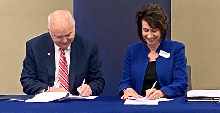 Dr. Mary S. Graham and Jo Bonner sign Pathway USA extension