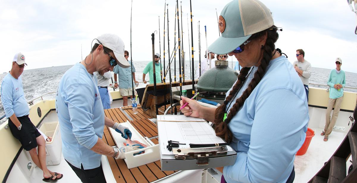 University of South Alabama graduate students and researchers survey red snapper south of Dauphin Island in the summer of 2021. Dr. Sean Powers, director of the Stokes School of Marine and Environmental Sciences, is to the far right.