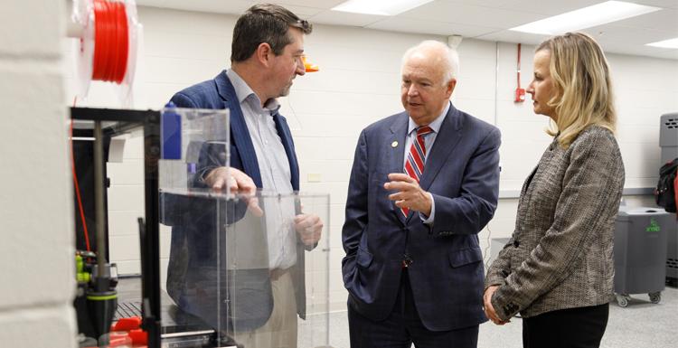 USA president Jo Bonner, executive vice president Dr. Andi Kent and Dr. Matt Reichert discuss the merits of South's new 3D lab.