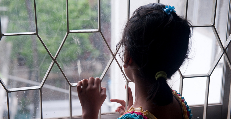 girl looking out of window