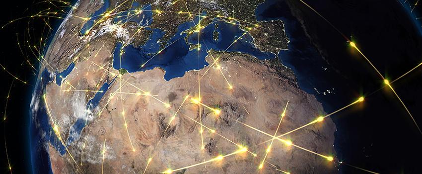 picture of globe with trade routes traced