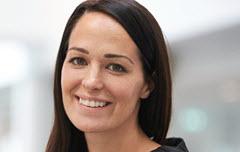 Woman with brown hair smiling